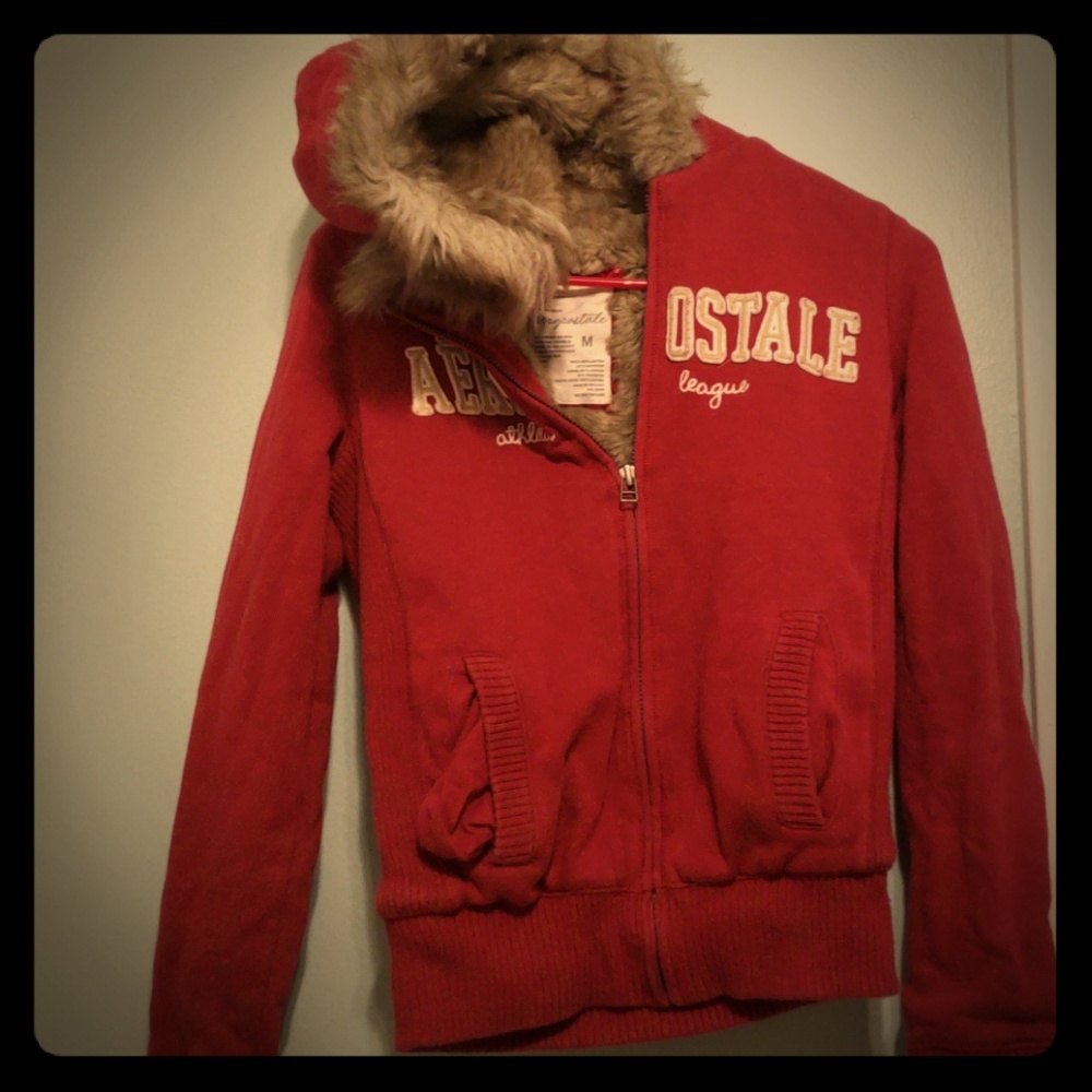 Zip up, fur inside says medium but runs small